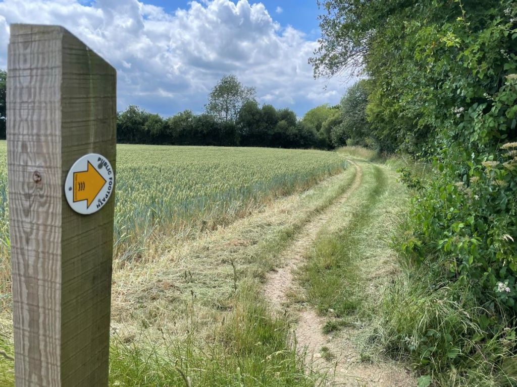 We mow the public footpaths at Slamseys to make it easier for you to walk Mown footpath and footpath sign